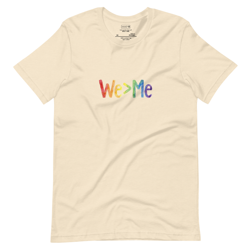 Minimalist T-Shirt design featuring "We > Me" typography filled with a hand-drawn rainbow gradient.