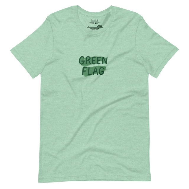 Minimalist t-shirt with “Green Flag” text and abstract green brushstrokes
