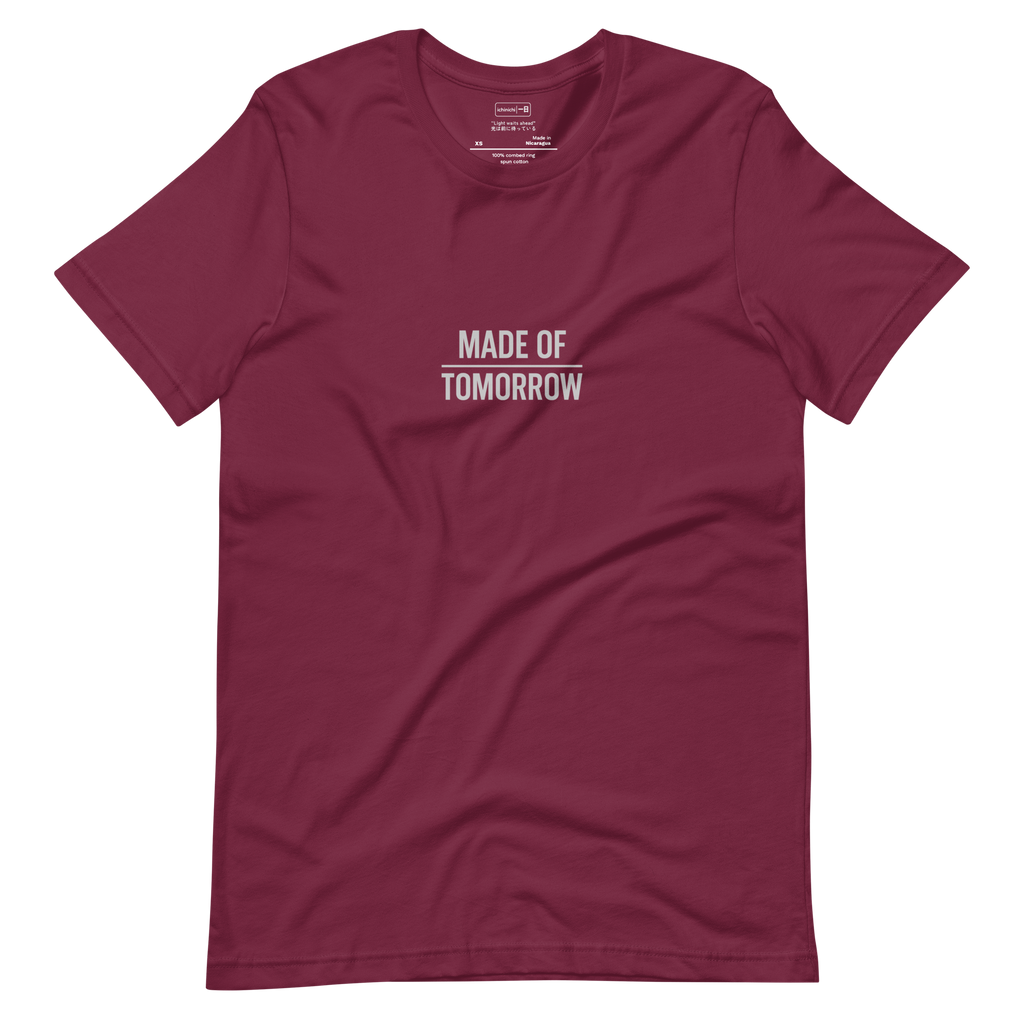 Minimal text design reading “Made of Tomorrow” with the word Tomorrow split by a thin horizon line
