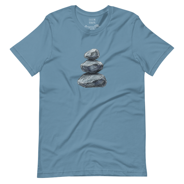 Minimalist line drawing of three stones stacked vertically in perfect balance on a T-Shirt.