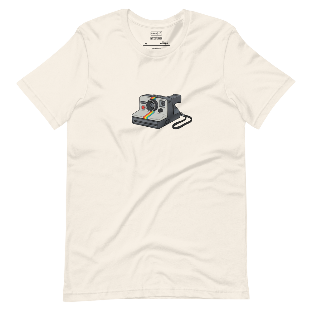 Marker illustration of a 1970s instant camera with a rainbow stripe and flash, centered on a Short Sleeve T-Shirt.