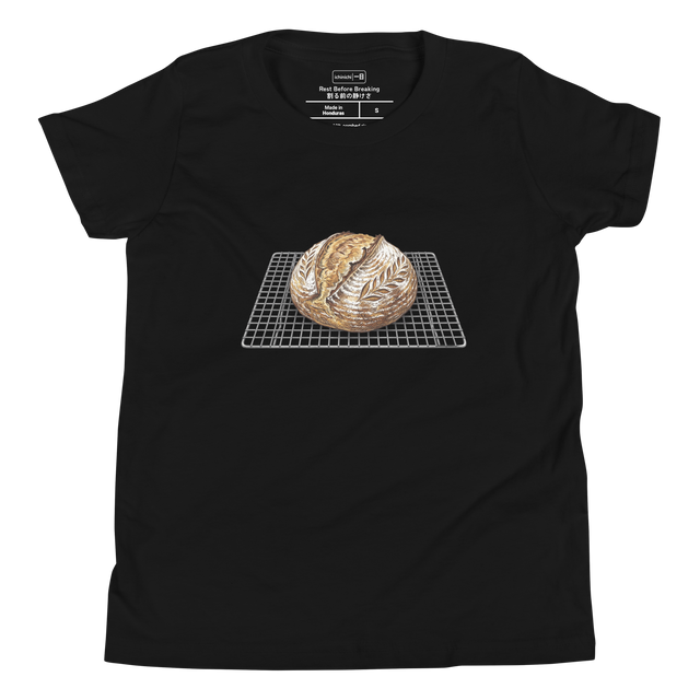 Youth T-Shirt displaying a colored pencil cross-hatch drawing of sourdough bread on a rack.