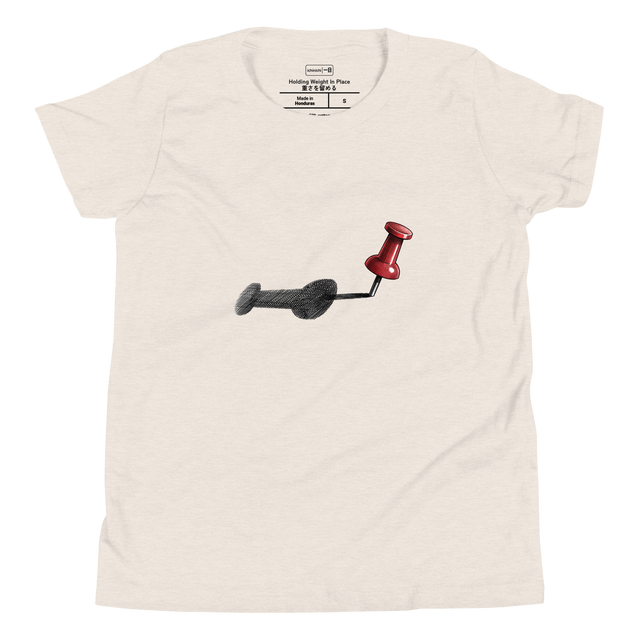 Descriptive graphic of a red thumbtack casting a long shadow in cross-hatch ink on a Youth T-Shirt.